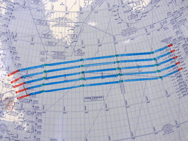 Flight path diagram detailing airspace navigation routes with red and blue lines indicating approved flight paths and green waypoints.